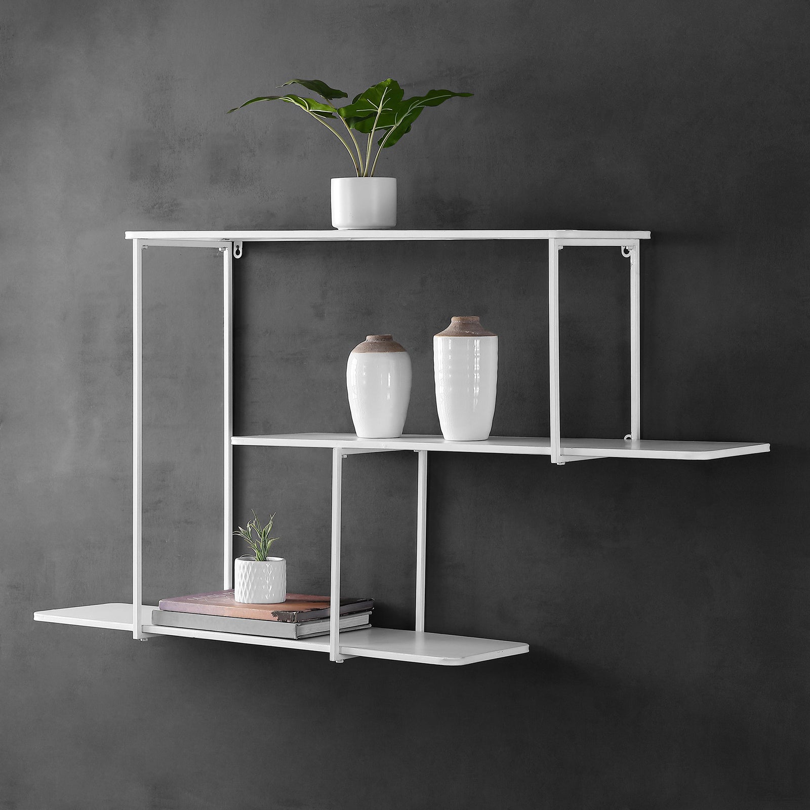 Staggered white shelves display plants, vases, and books in an airy arrangement || WDC5001B || front_room