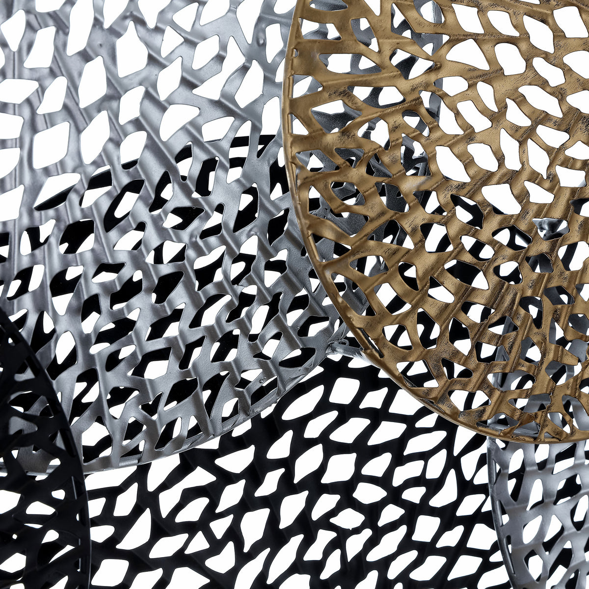 Layered silver, bronze, and black disks reveal intricate cutouts and richly textured metal. || WDC5019A || detail_studio