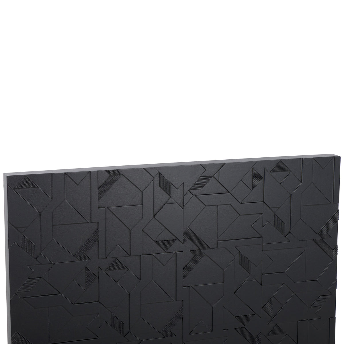 Raised angular forms and fine grooves create a richly textured black wall accent.