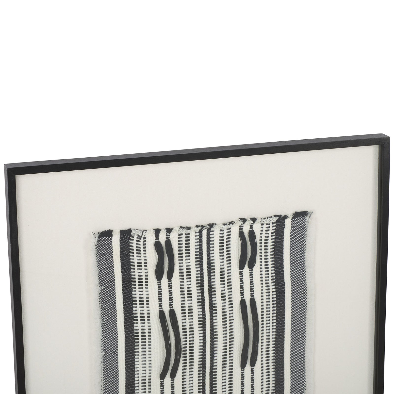 A slim black frame gives the woven black-and-white textile art a crisp, modern edge. || WLA1900A || detail_studio