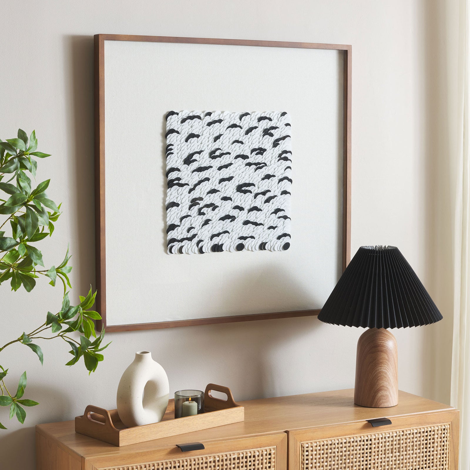 A warm brown frame and white mat set off textured black-and-white wall art || WLA1901A || front_angle_room