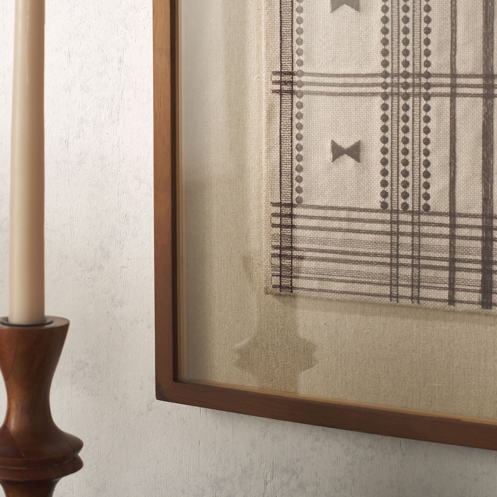 Fine brown linework and dotted bands contrast with textured cream fabric and a warm wood frame || WLA1904A || detail_room