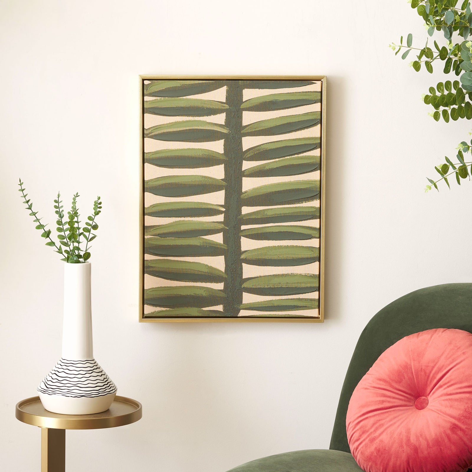 Green botanical artwork in a slim gold frame adds a natural accent to a neutral wall. || WLA2075A || front_room