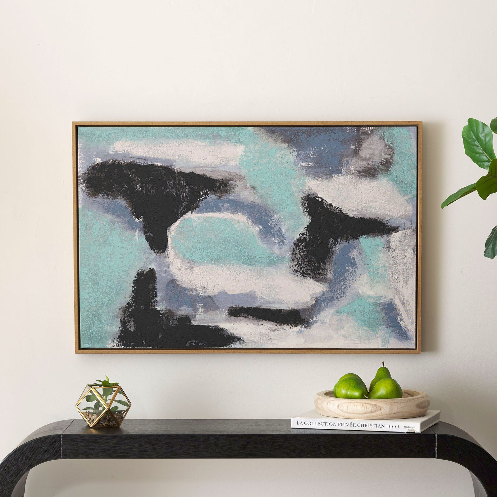 A framed abstract canvas adds sweeping seafoam, blue, white, and black color above a modern console || WLA2077A || front_room