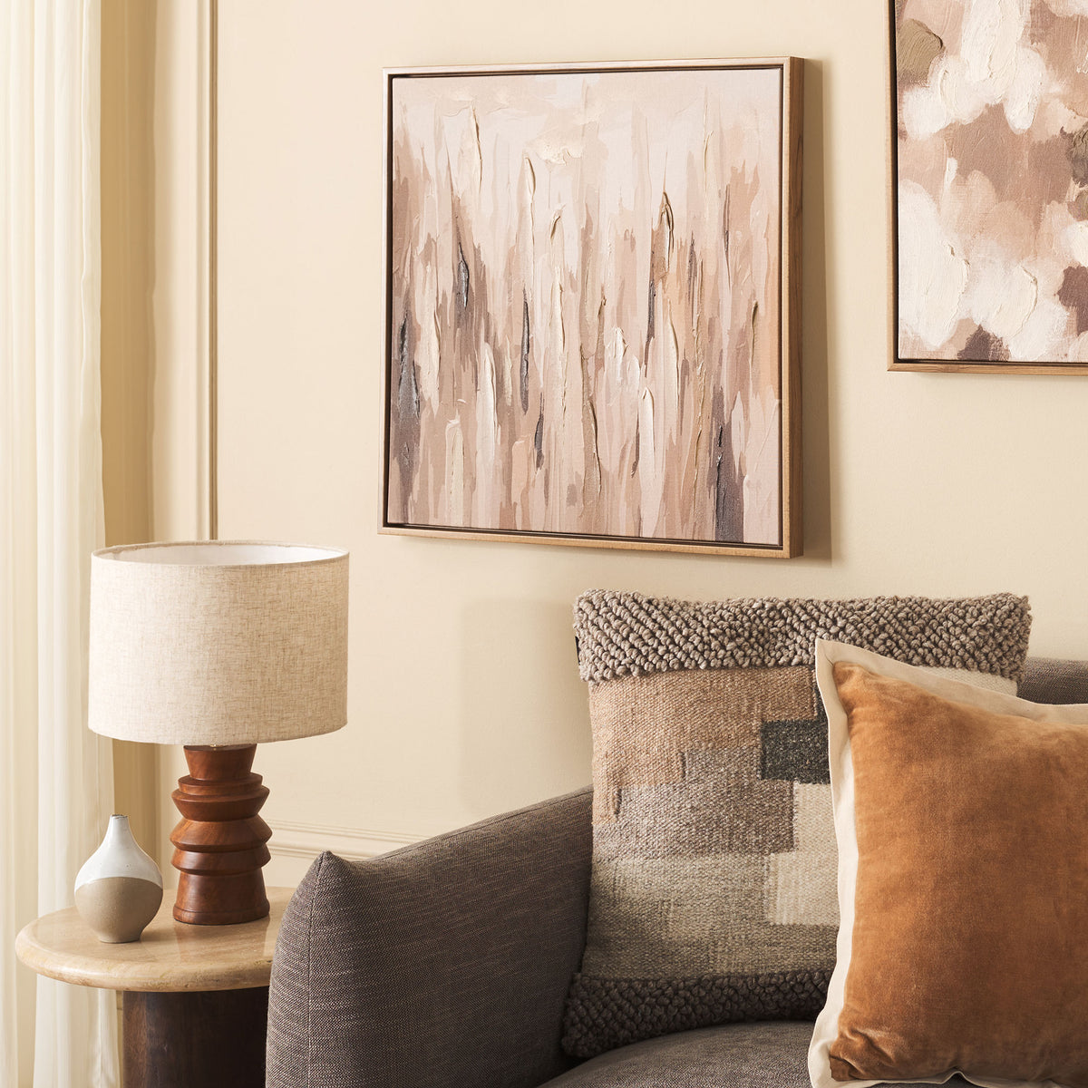 Soft, earthy brushstrokes bring warmth and texture to a neutral living space.
