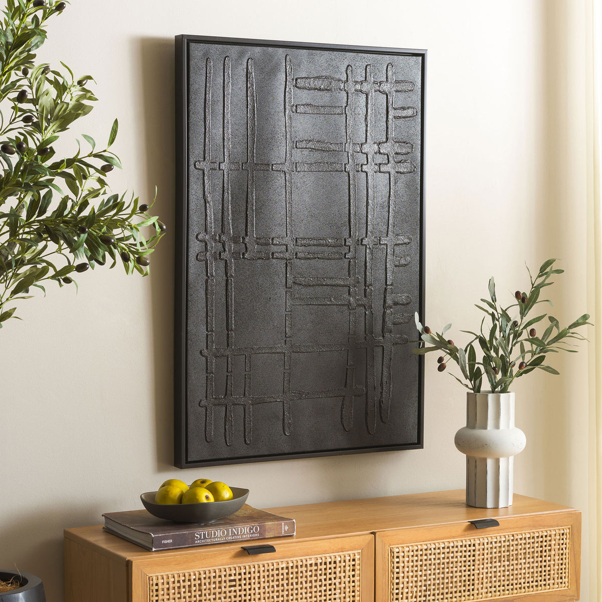 Slim black framing and dimensional linework give this wall art a bold, modern presence.