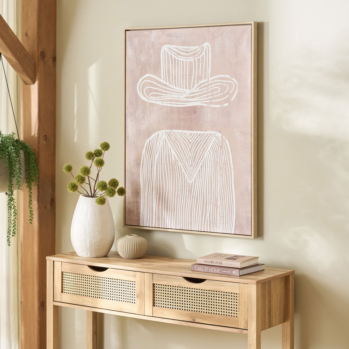 White Western-inspired linework on mauve canvas brings a gentle accent above a natural wood console. || WLA3041A || front_angle_room