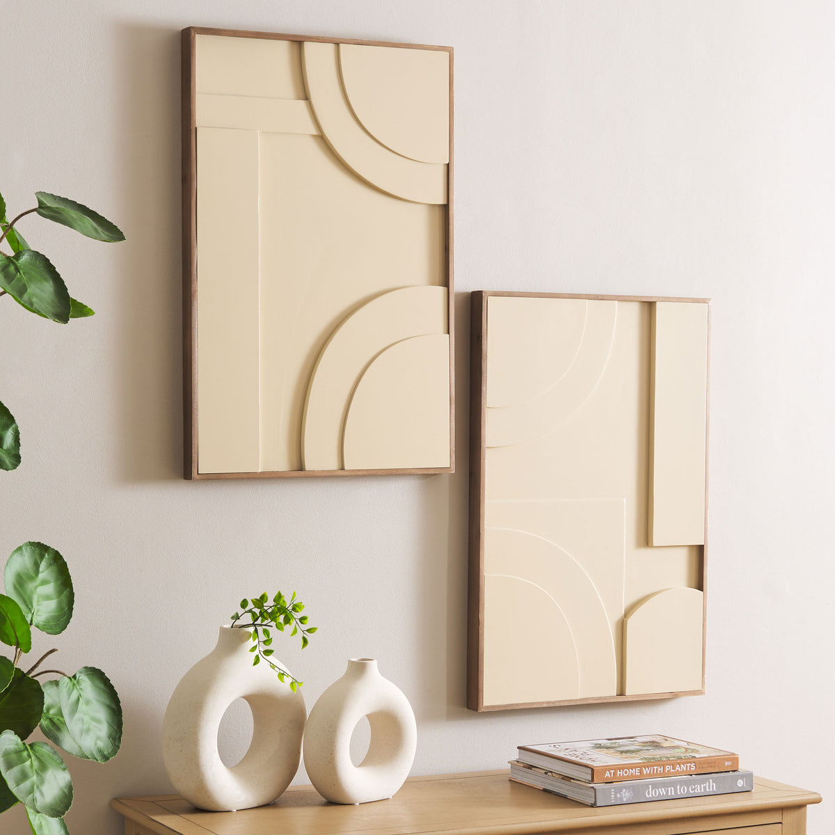 Two cream relief panels add sculptural warmth to a neutral wall above a natural wood console || WLA9001A-SET2 || front_angle_room