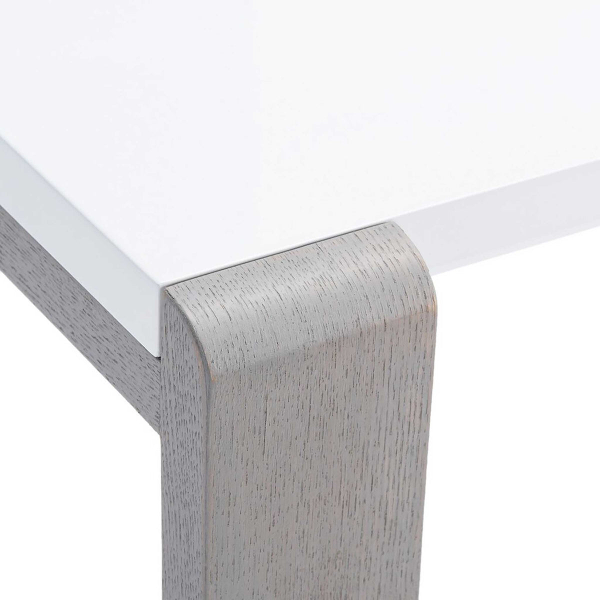 White lacquer tabletop meets a rounded gray wood-grain corner with clean lines
