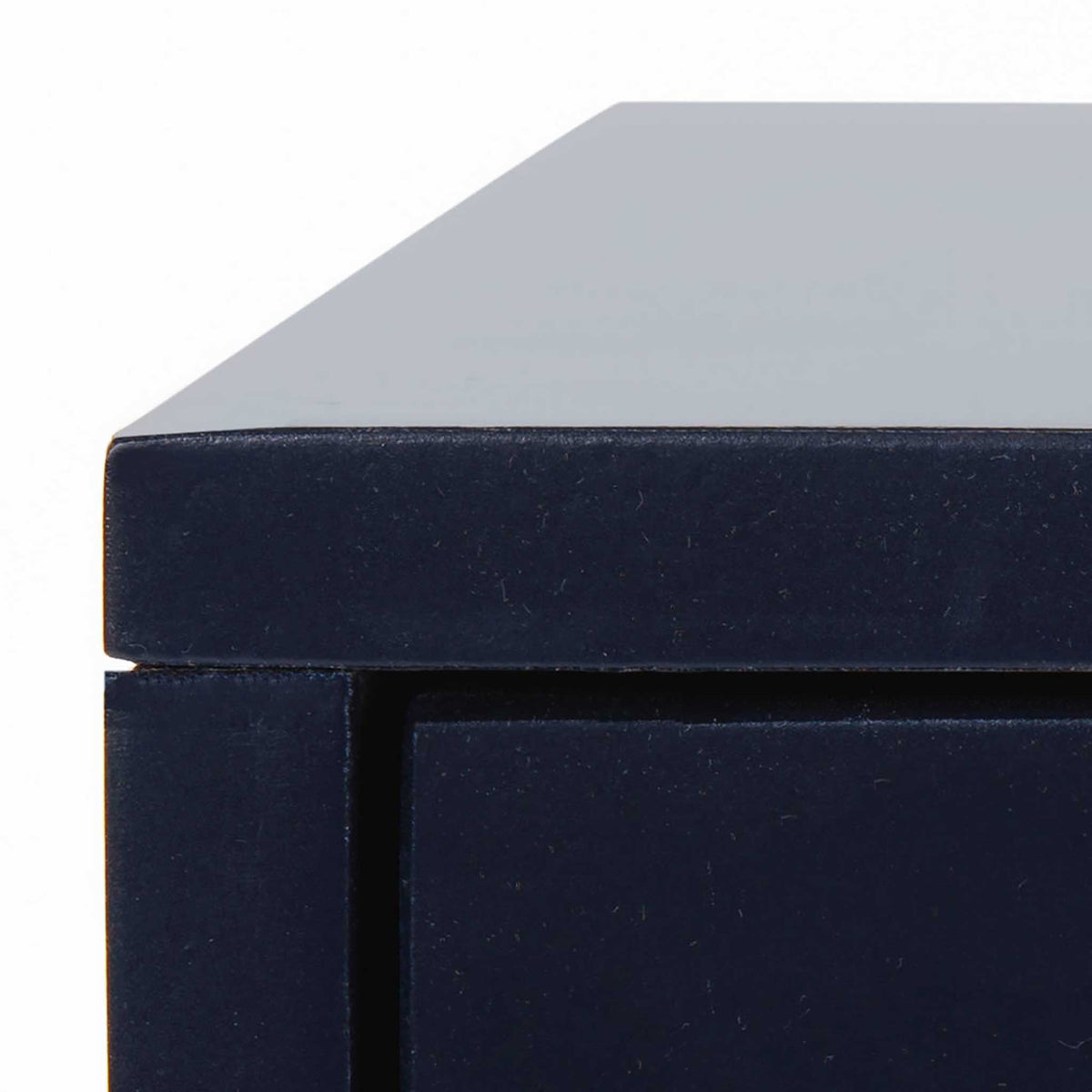 Crisp tabletop edges and a smooth navy finish define the streamlined case