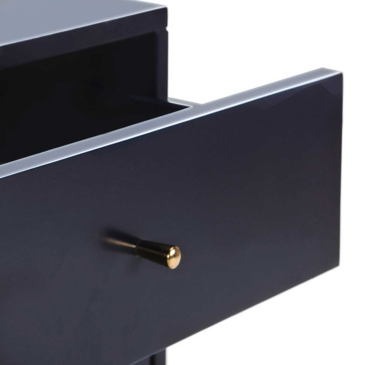 A slim gold drawer pull adds a luminous accent to the navy finish
