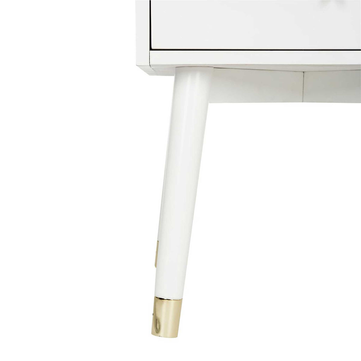 A gently splayed white leg ends in a gleaming gold-toned metal cap