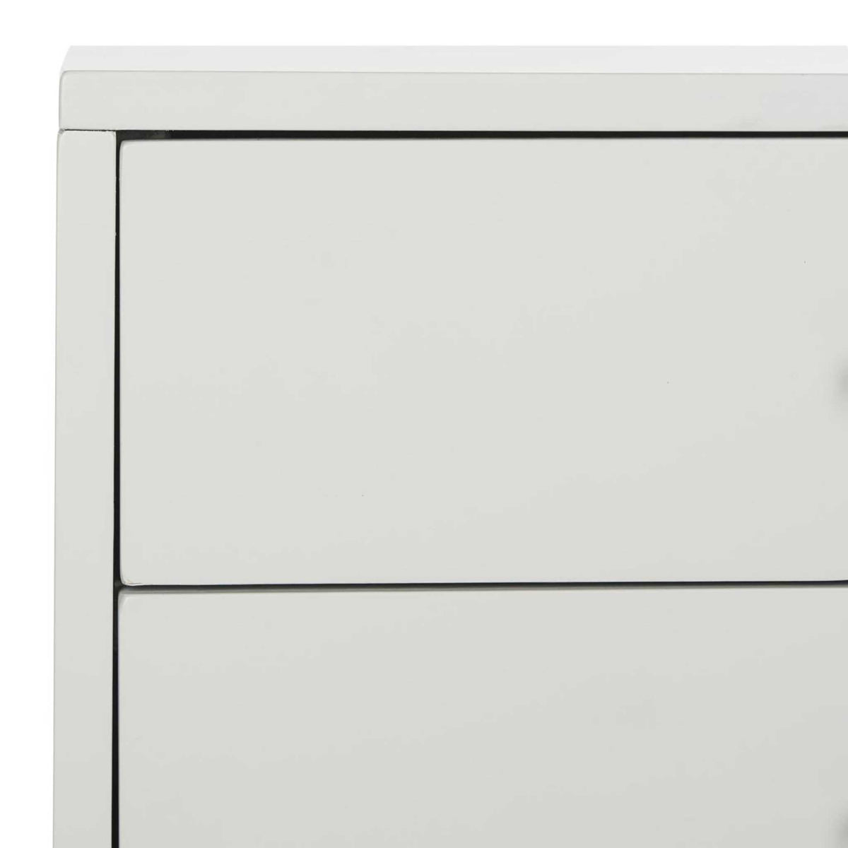 Fine, dark seams outline the pale gray drawers beneath the clean tabletop edge