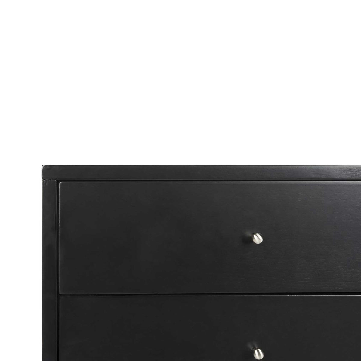 Black drawer fronts and small silver knobs lend contrast to the clean-lined cabinet