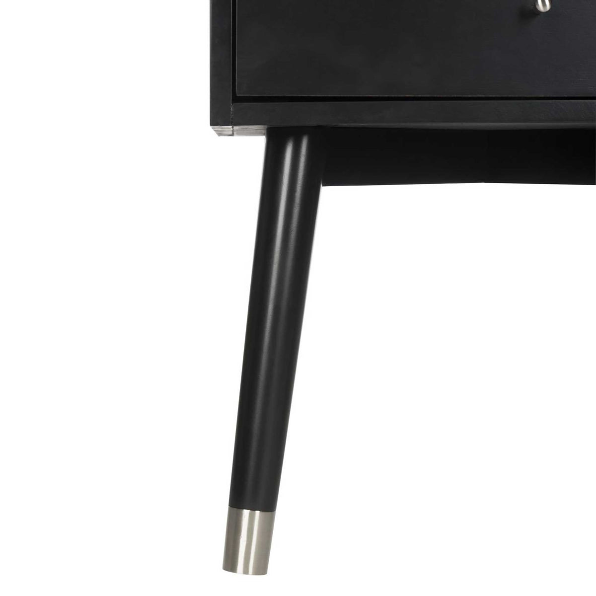 A tapered black leg finishes with a silvery metal cap