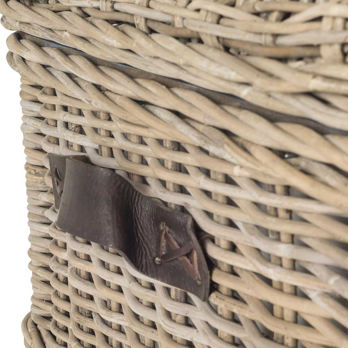 A dark side handle stands out against the gray, textured rattan weave