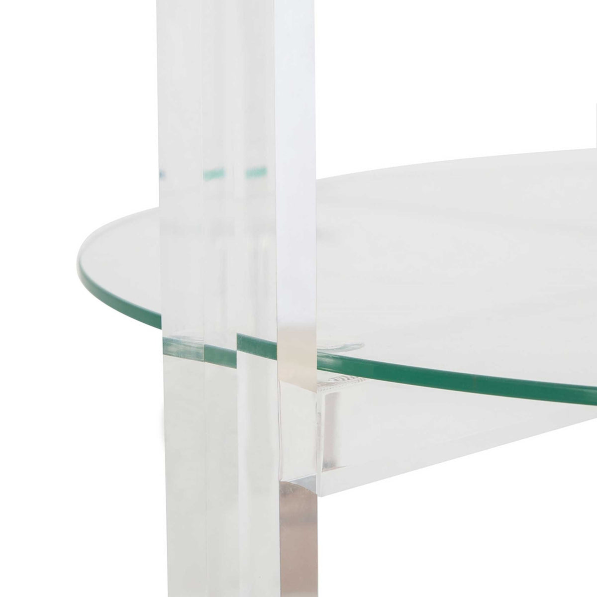 A glass shelf meets a clear acrylic upright, highlighting the cart's transparent construction.