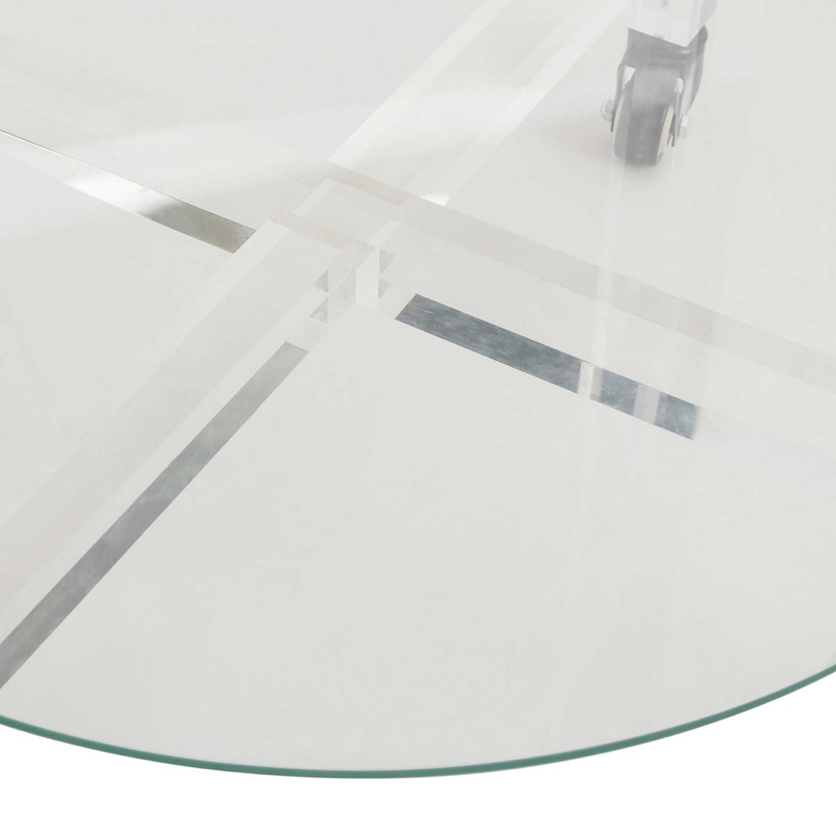 A rounded glass shelf reveals intersecting acrylic supports beneath its transparent surface.