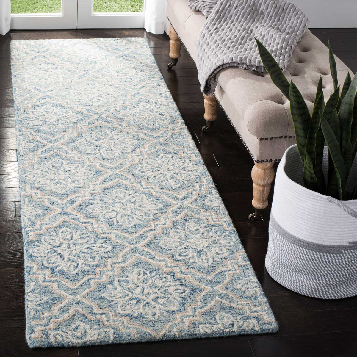 Soft blue and gray wool runner adds intricate floral motifs and cozy texture to a living space