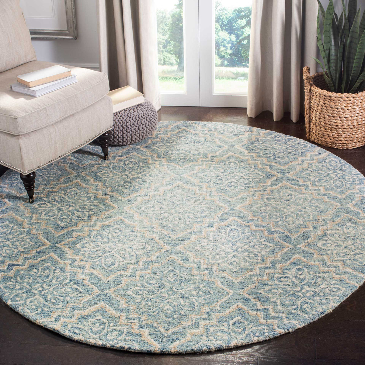 A round blue and gray medallion rug lends soft color and intricate pattern to a bright living space.