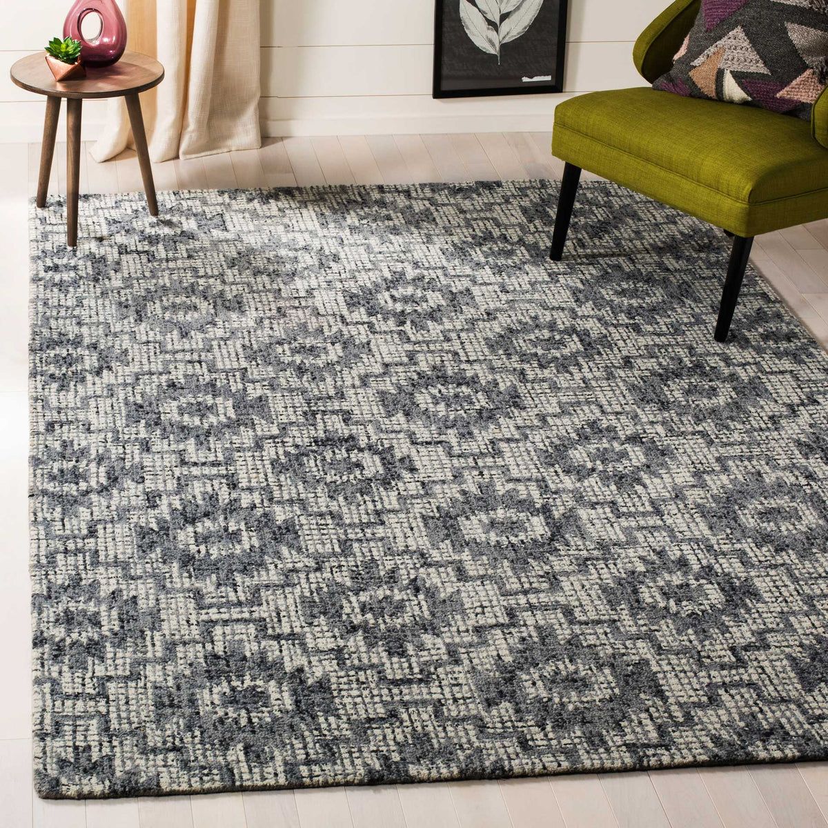 Weathered ivory and dark gray medallions bring geometric warmth to a living room