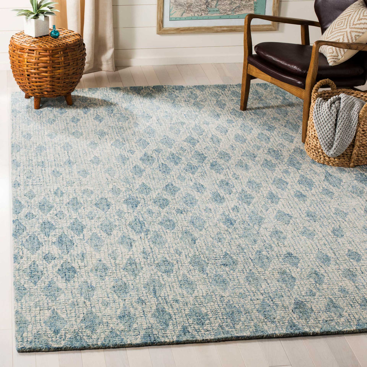 Soft blue motifs on ivory wool bring a calm, textured foundation to a cozy living space