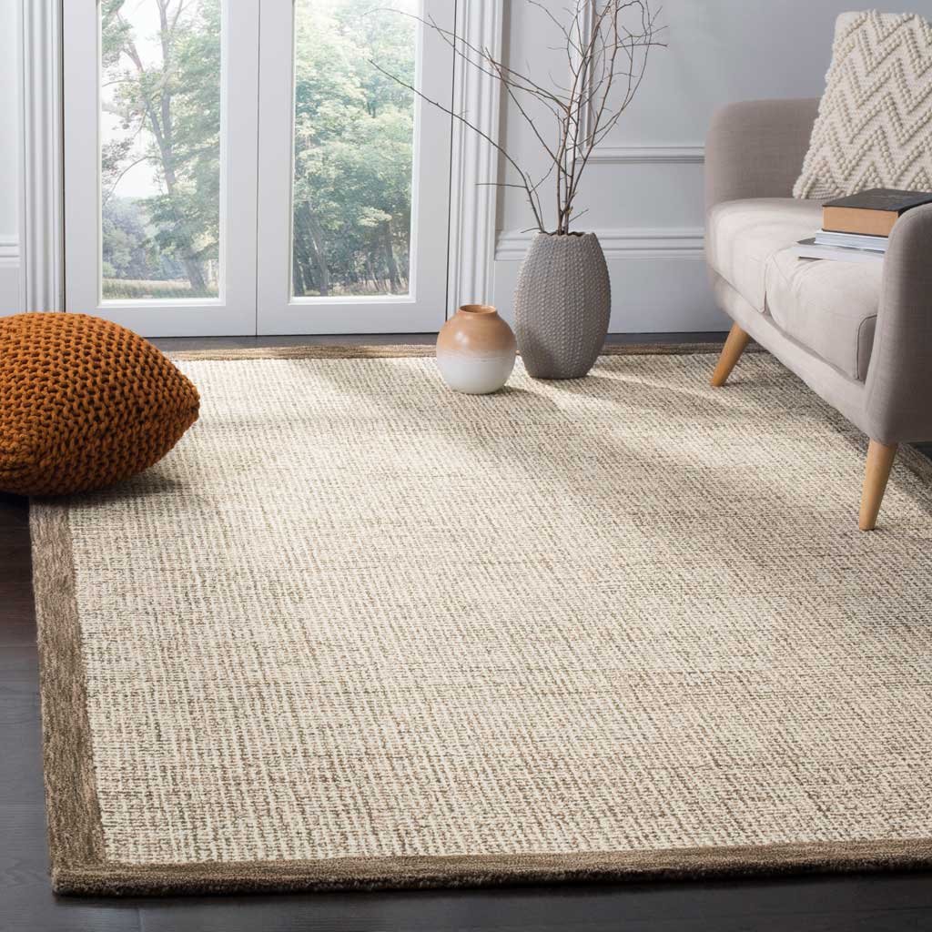 Warm brown edging frames the ivory rug, with subtle crosshatching throughout.