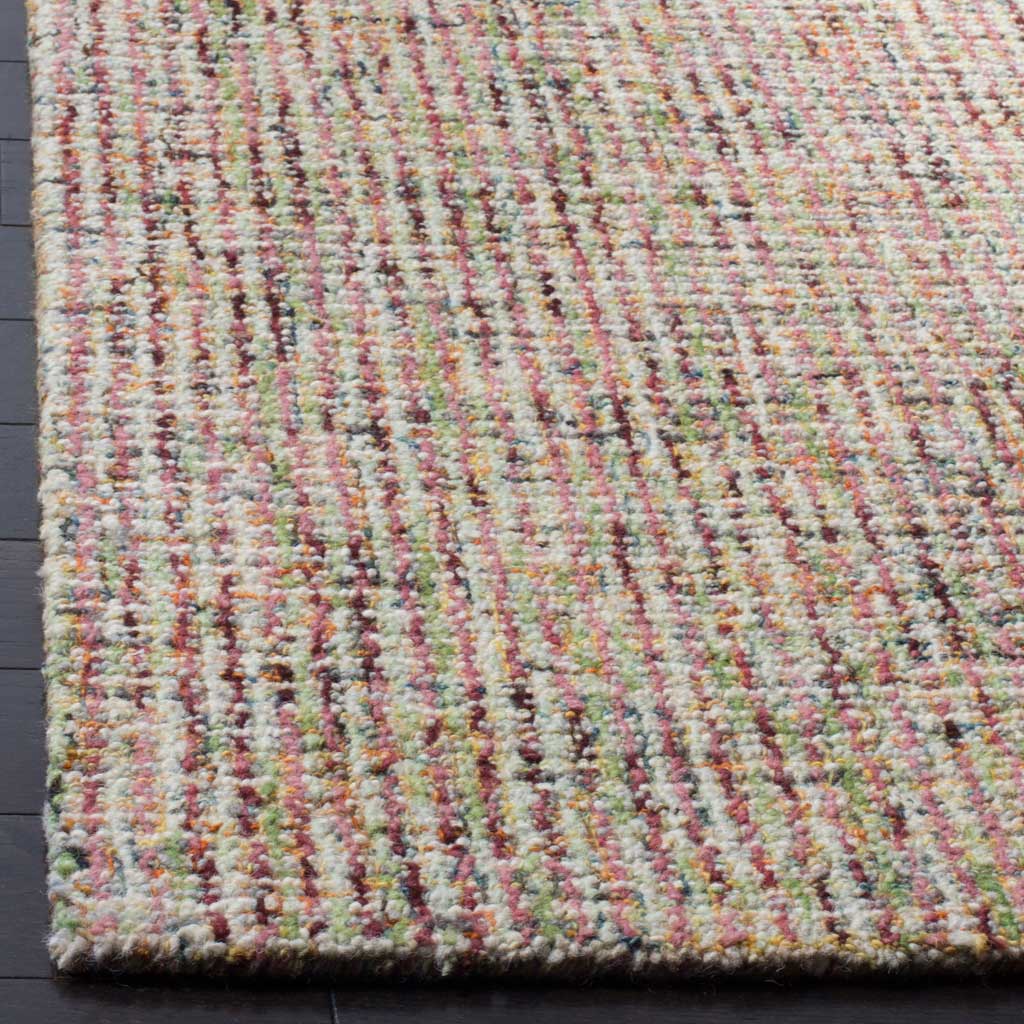 A softly textured wool pile meets a neatly finished edge in warm beige and rust.