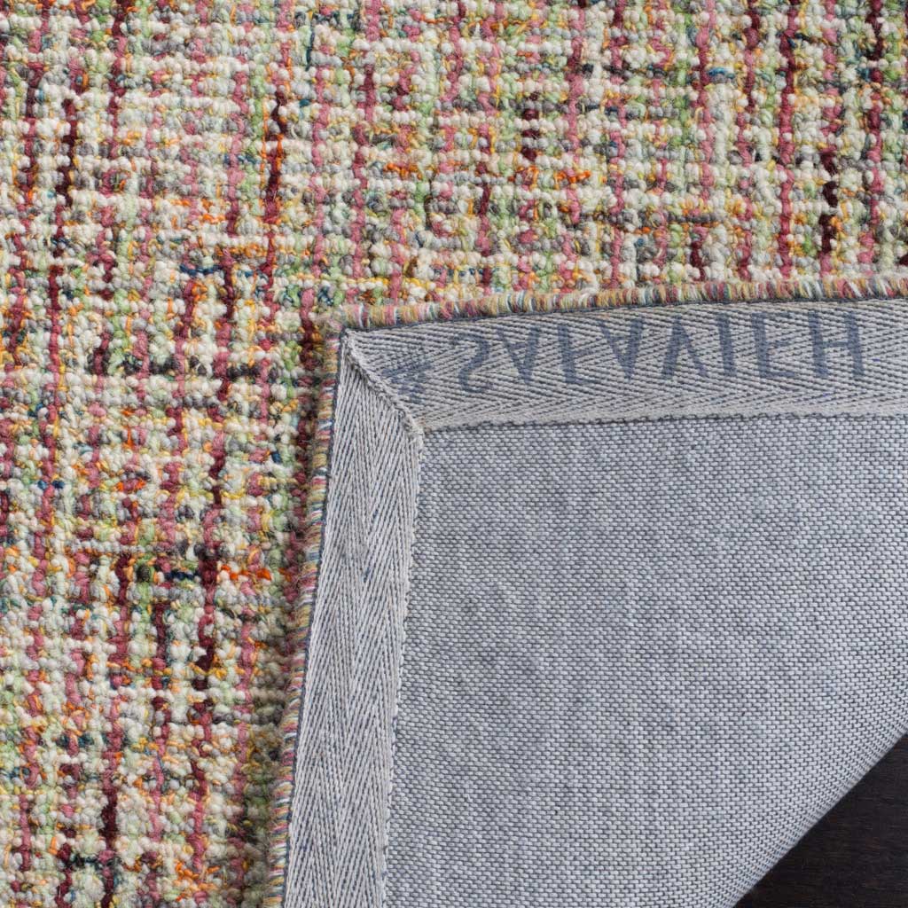 Sturdy cloth backing and bound edges support the rug's multicolored wool pile.
