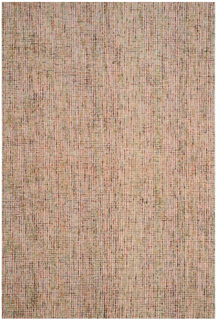 Hand-tufted wool blends warm gold tones with muted blue for a subtly mottled rug.