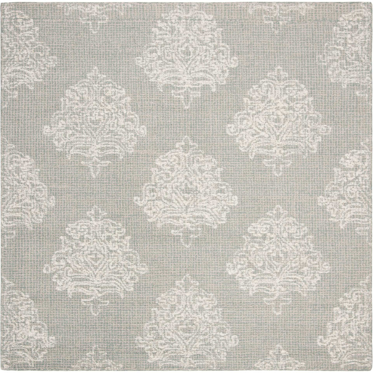 Square aqua wool rug patterned with large ivory damask flourishes and softly finished edges.