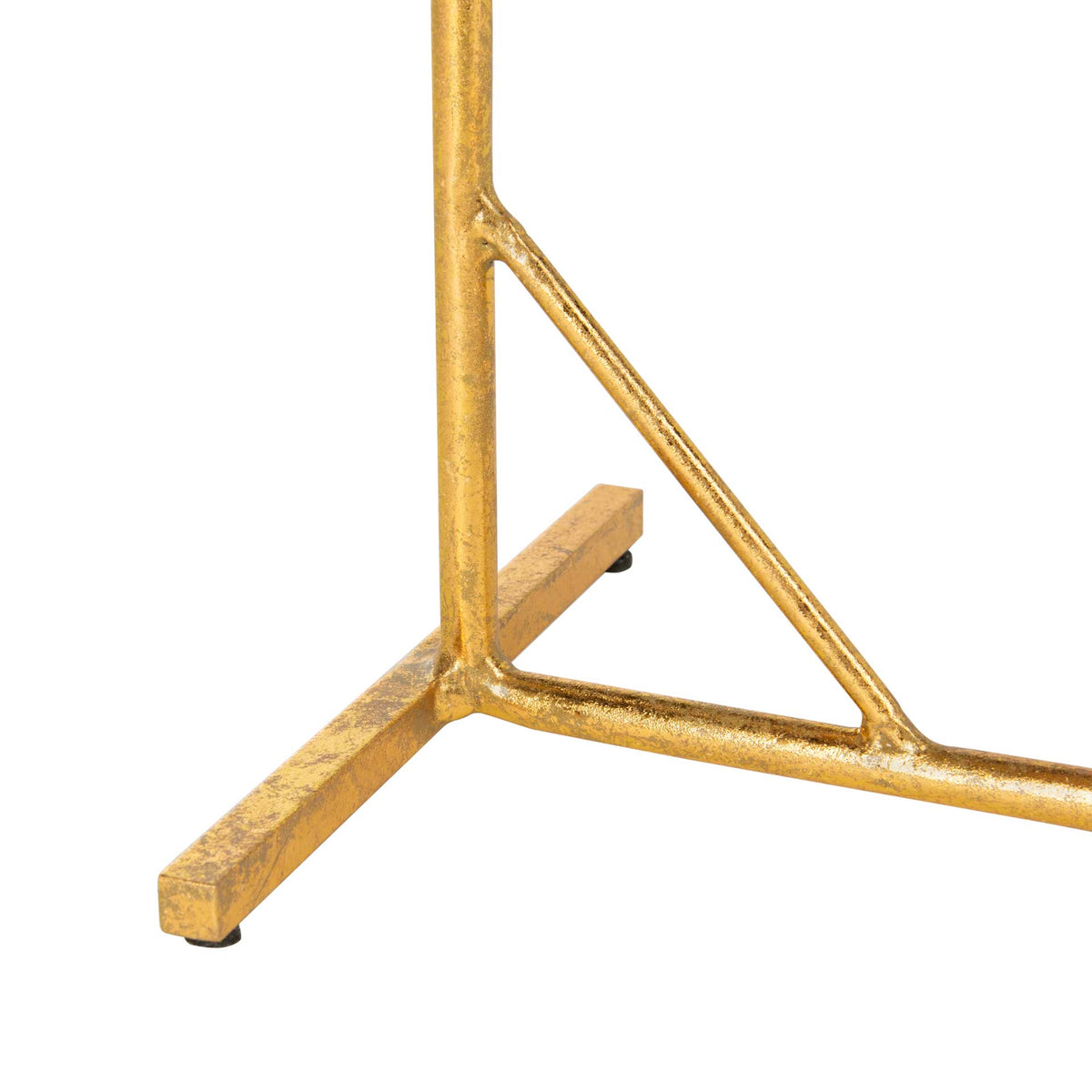 Textured gold iron feet and triangular bracing anchor the slender table frame.