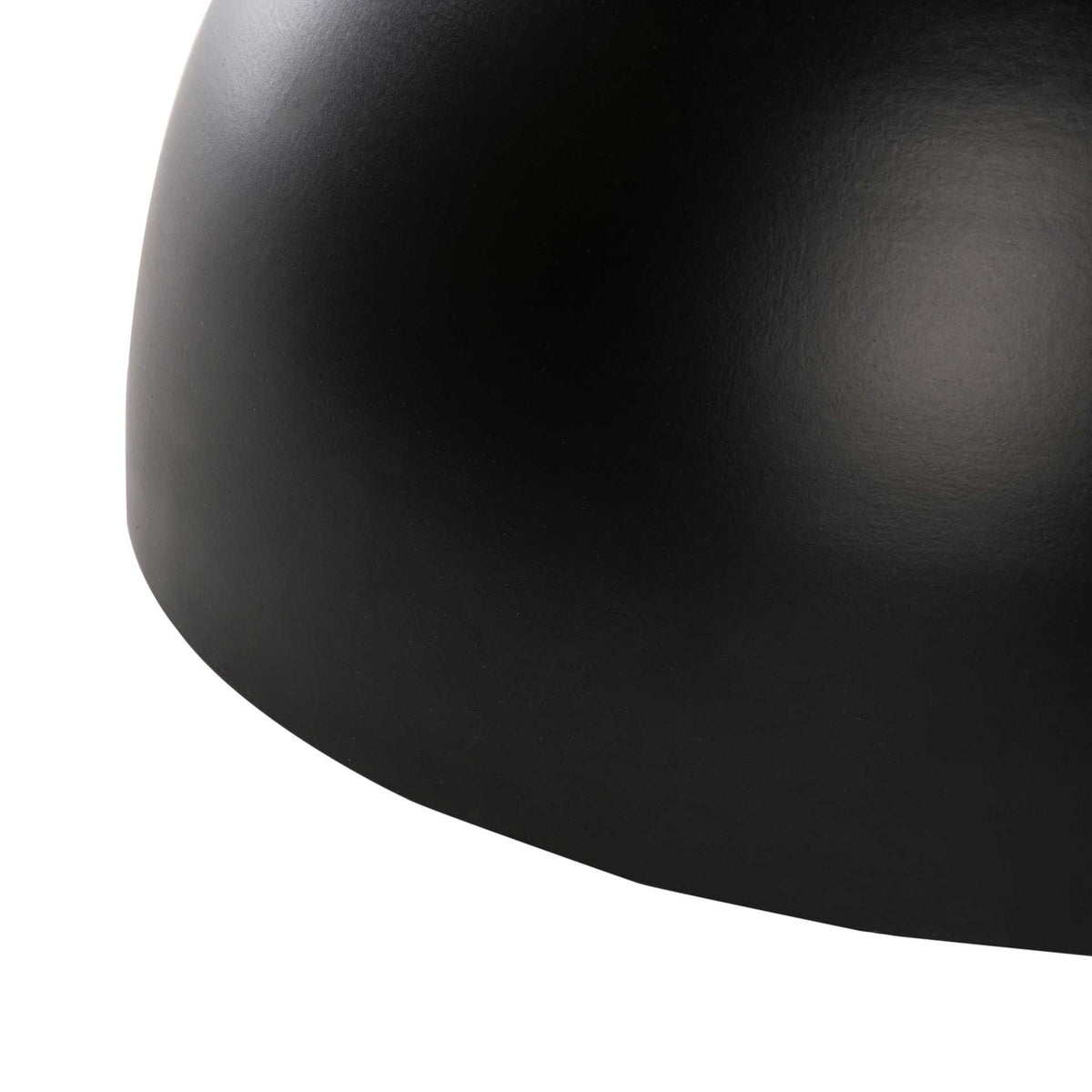 Rounded black metal base gives the table a sculptural foundation
