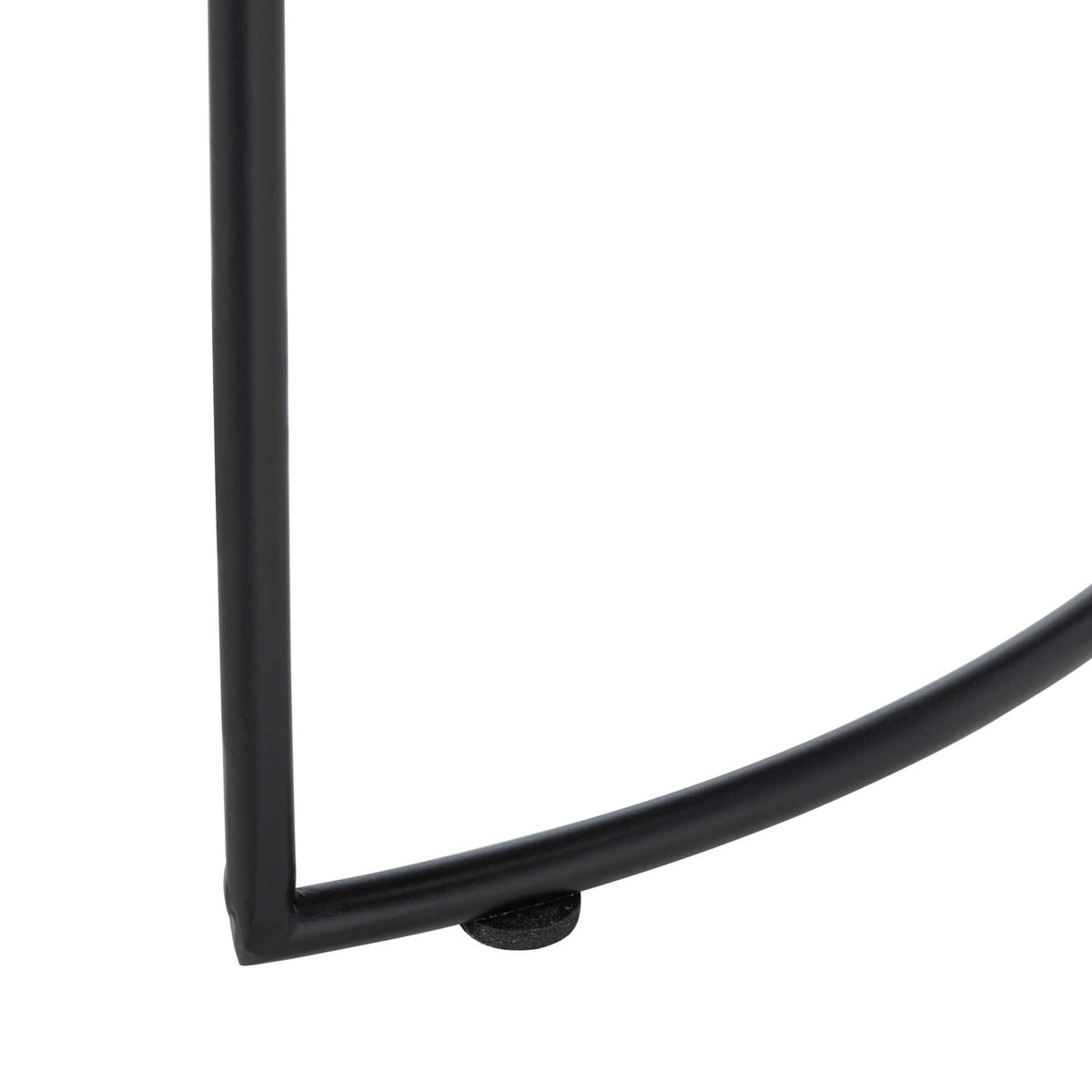 A slender black iron leg meets a curved base rail above a small floor foot.