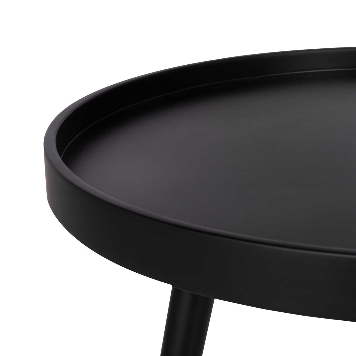 A raised rim gives the matte black tabletop a clean, tailored edge.