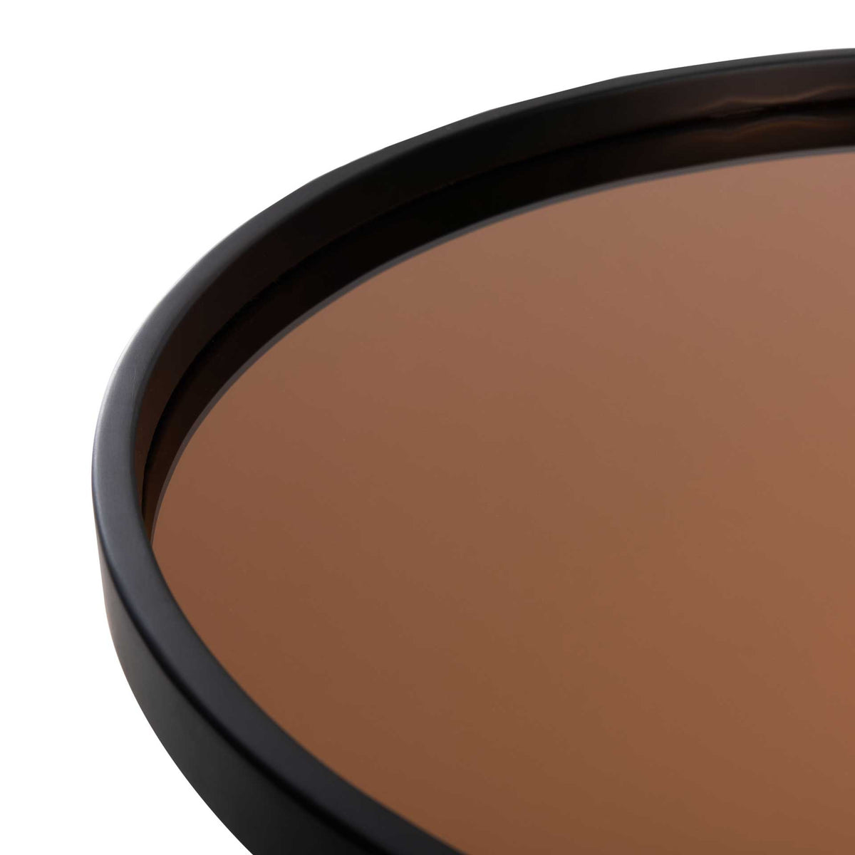 Reflective rose gold glass meets a smooth, raised black rim for a refined tray-style tabletop