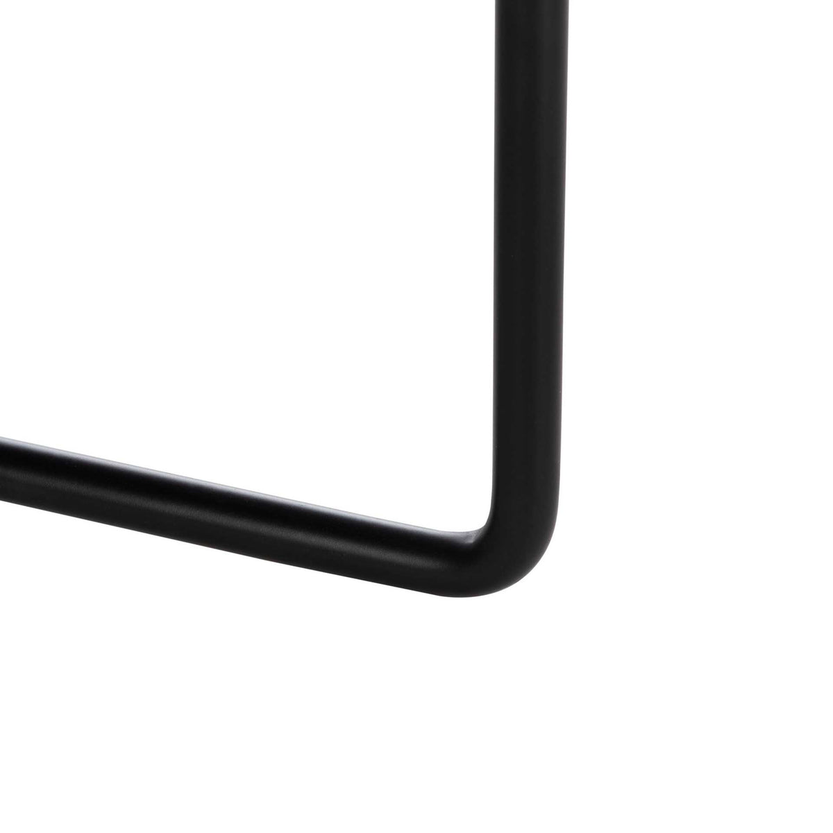 A gently curved black iron leg joins the low-profile base in a clean, minimalist design
