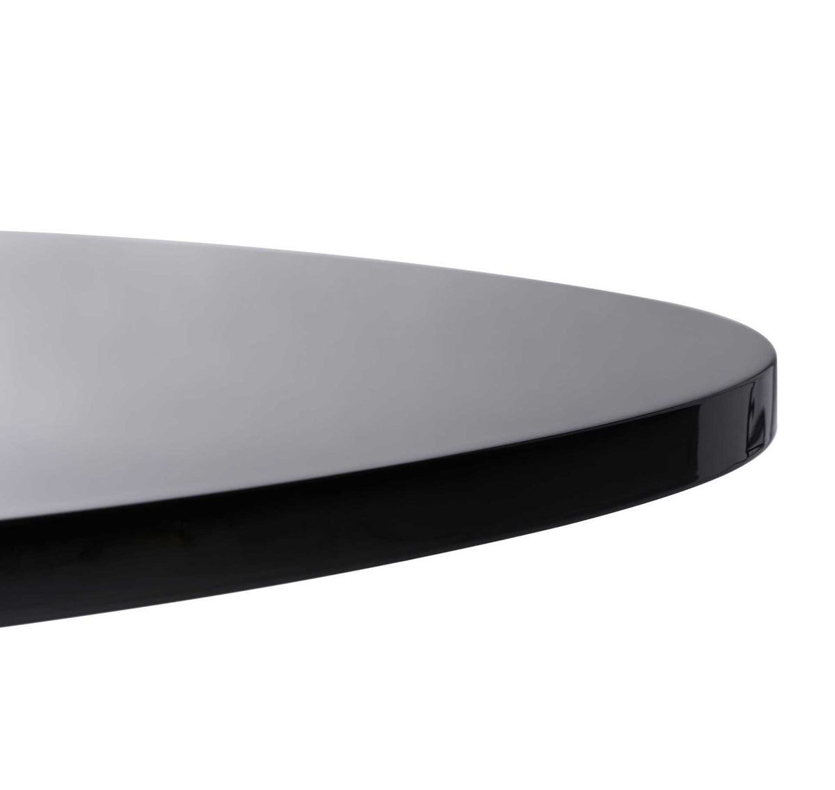 Smooth black lacquer wraps the rounded edge of the sculpted tabletop.
