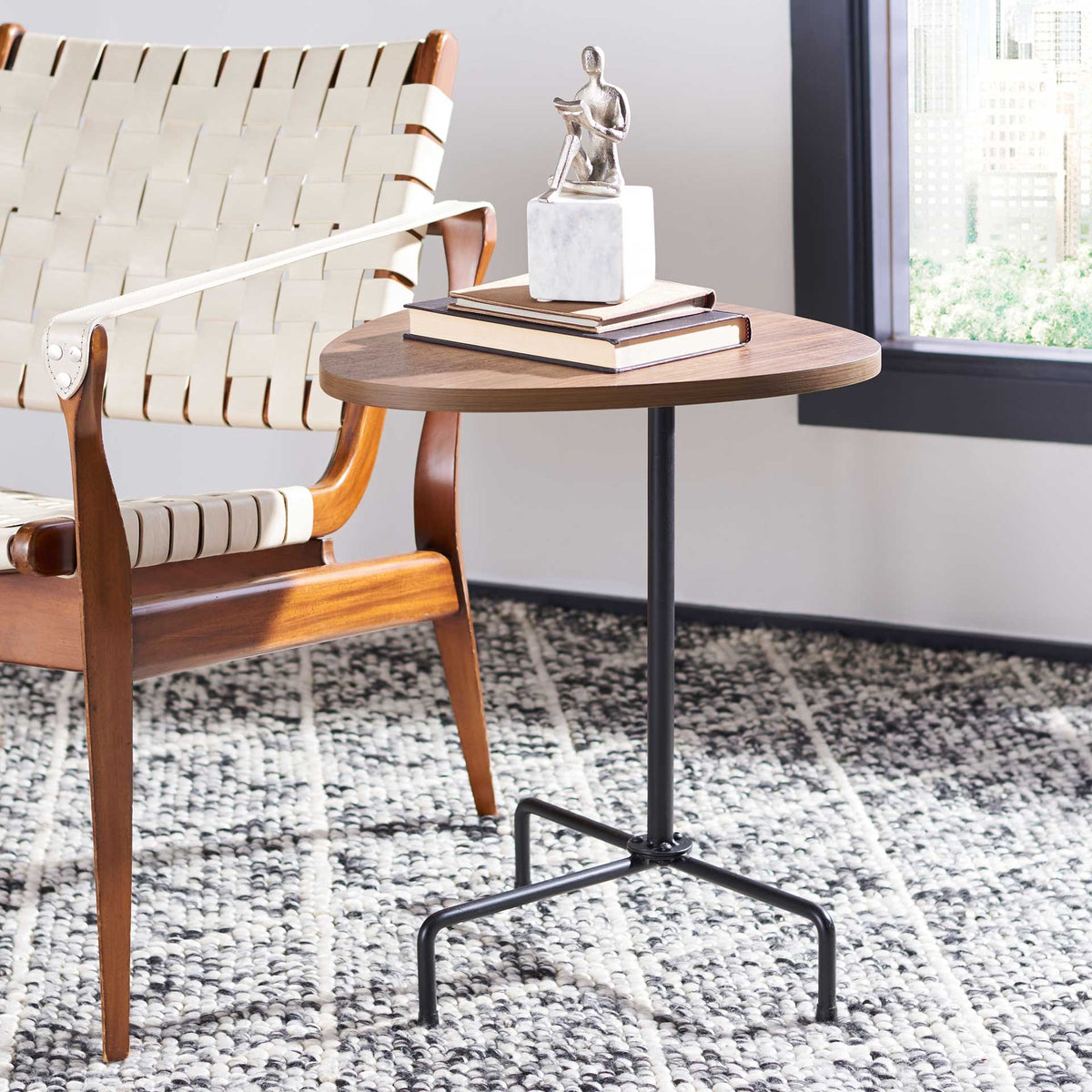 Walnut veneer top adds warmth to a compact perch on slender black metal legs.