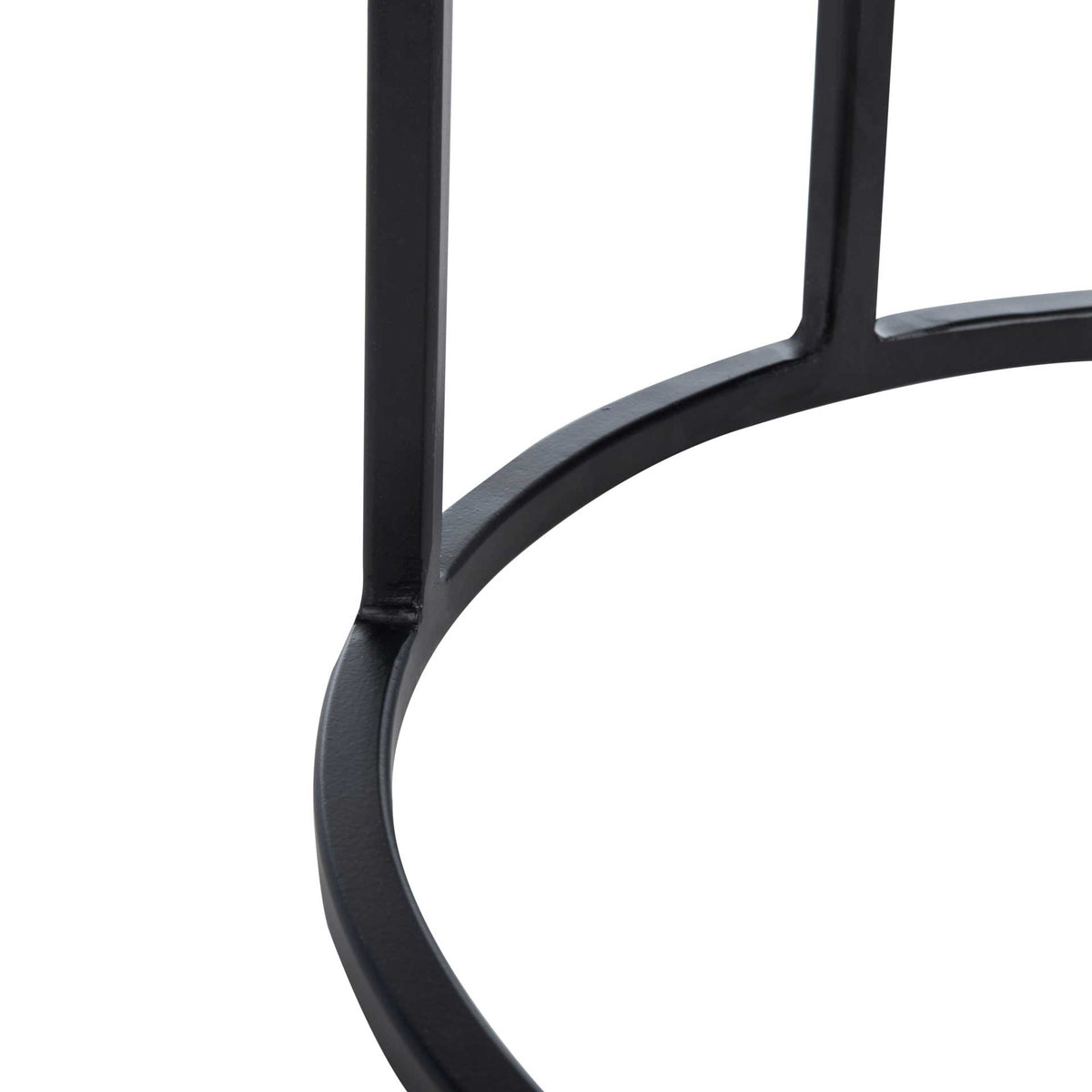 Black metal supports join a circular base for a light, open silhouette