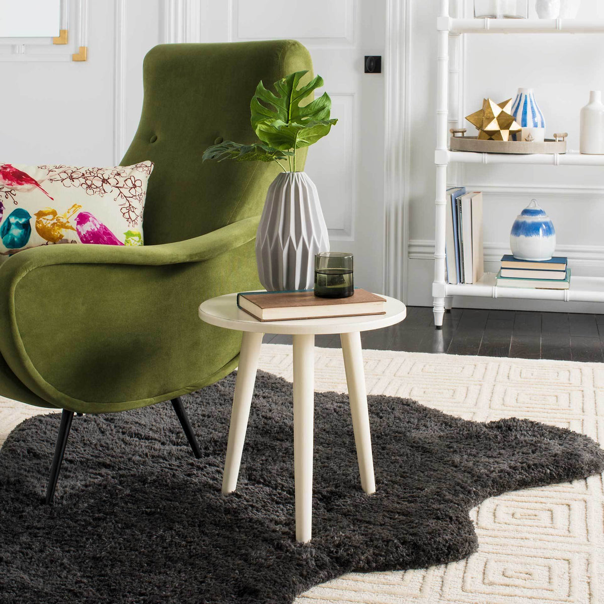 Vintage white finish brightens the circular top and splayed, tapered legs