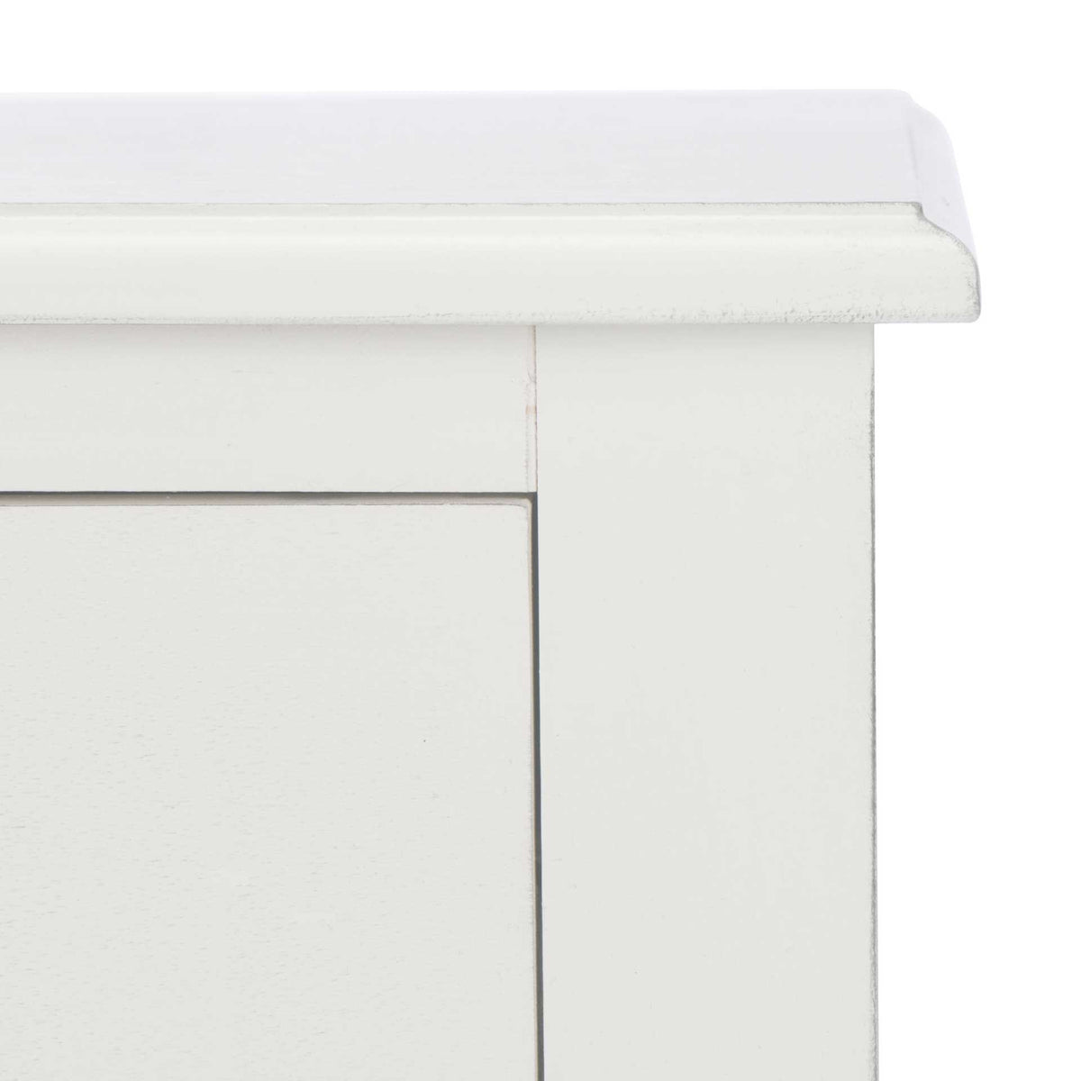 Subtle distressing outlines the white tabletop edge and clean-lined drawer frame