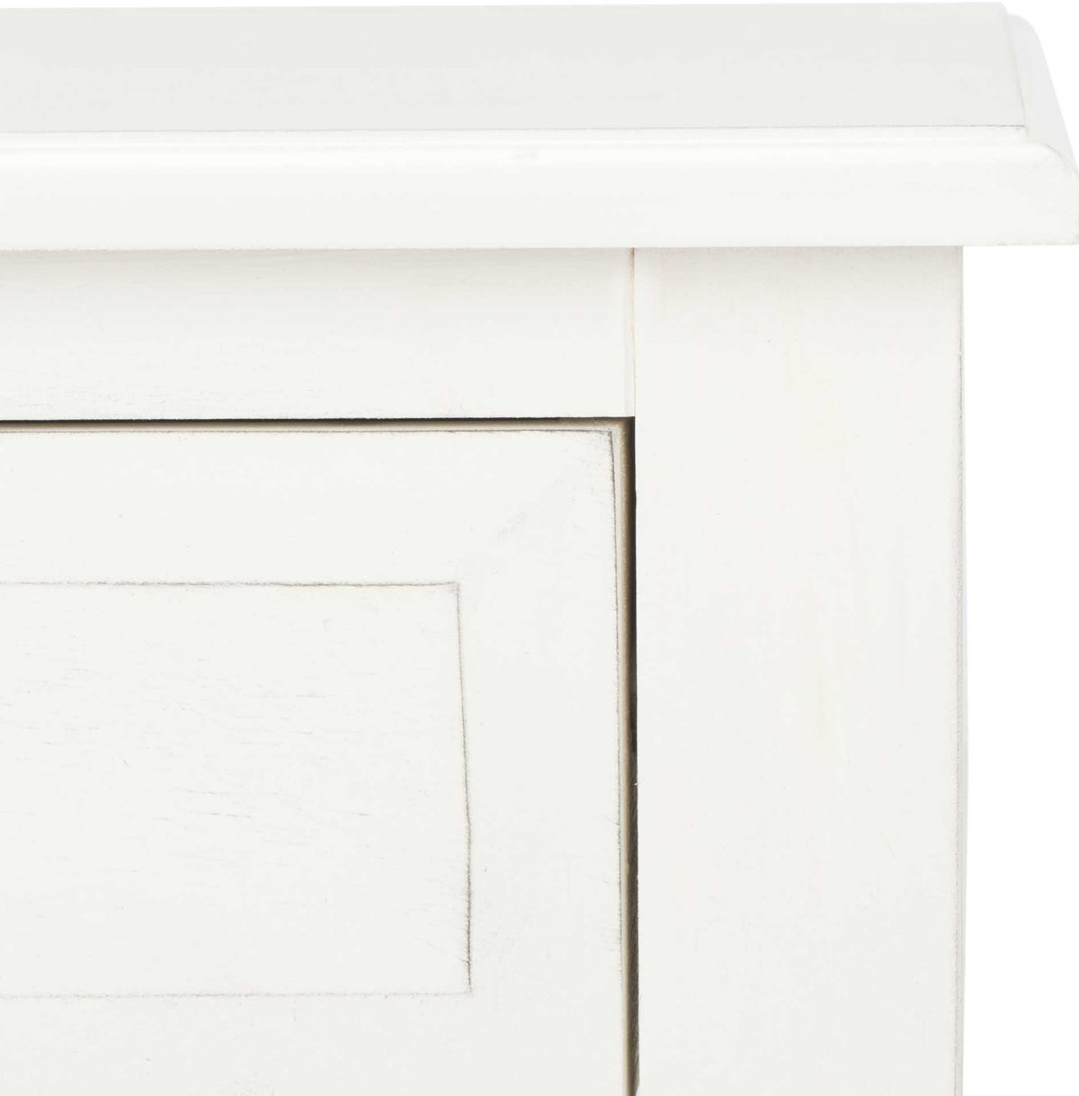 Subtle distressed edges give the white drawer panel and molded tabletop vintage character