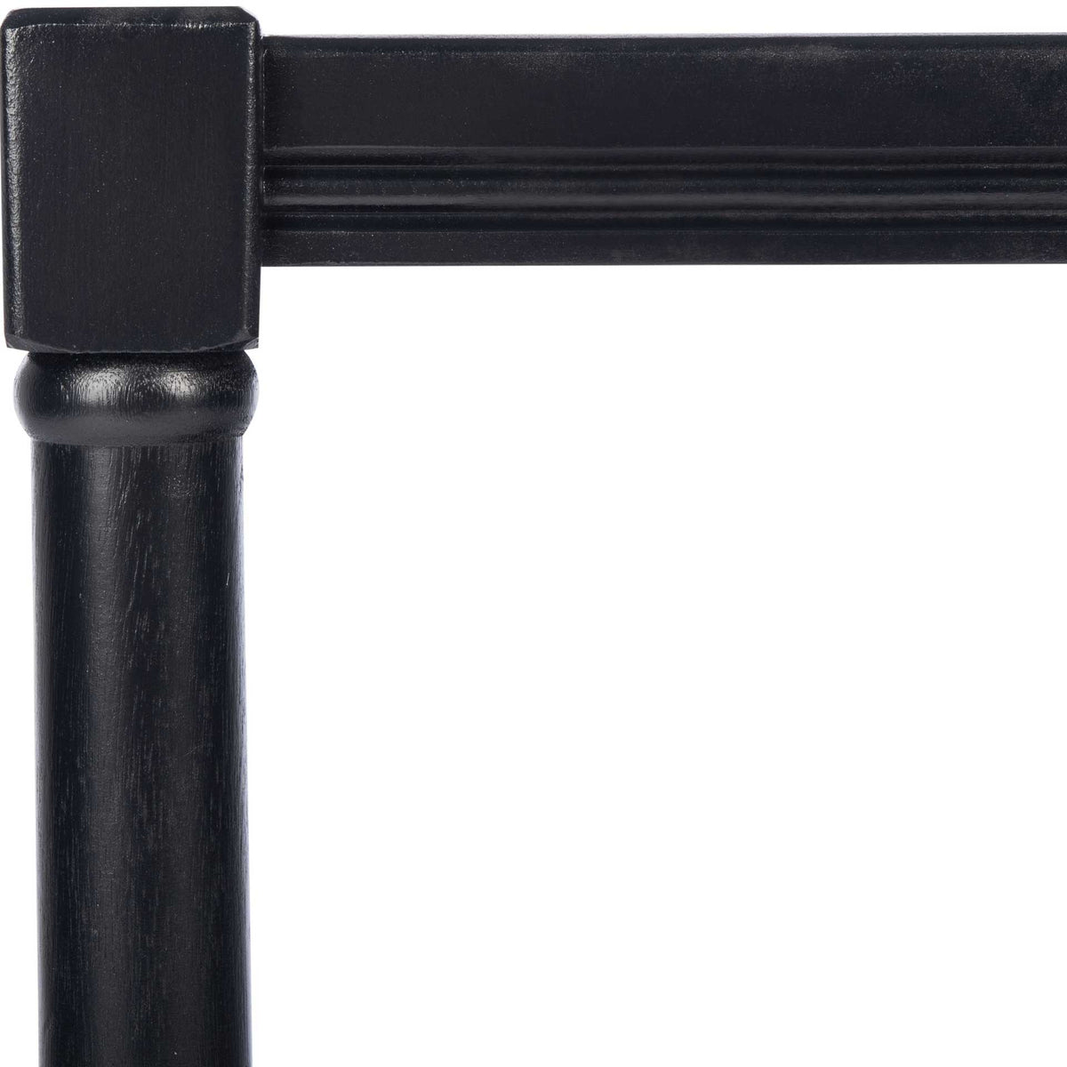 Black table corner with a square post, turned leg and molded apron trim