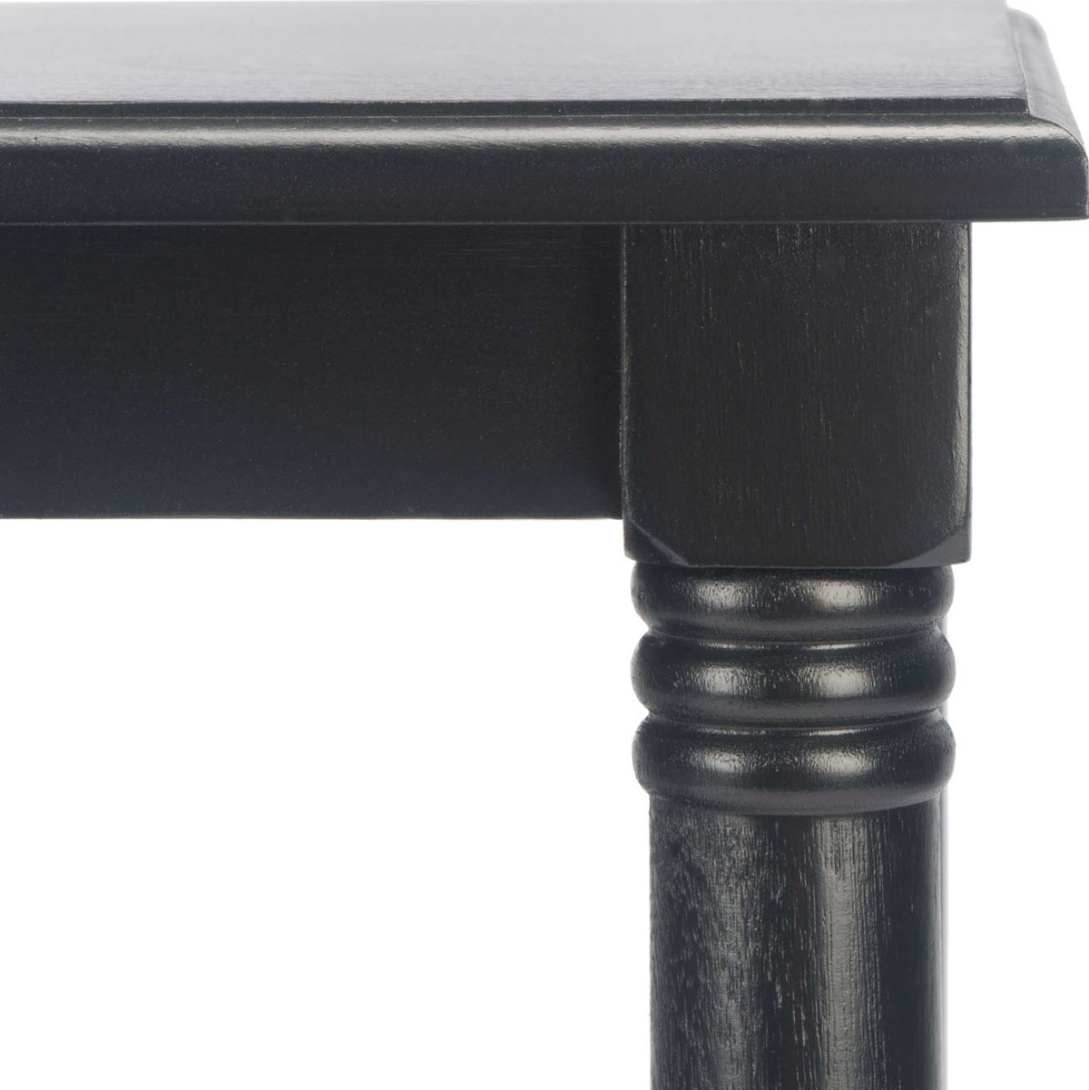 Black turned table leg features decorative rings beneath the tabletop edge.