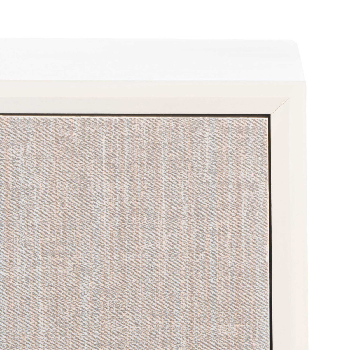 A pale, finely textured drawer front sits inside the crisp white frame beneath the smooth tabletop.
