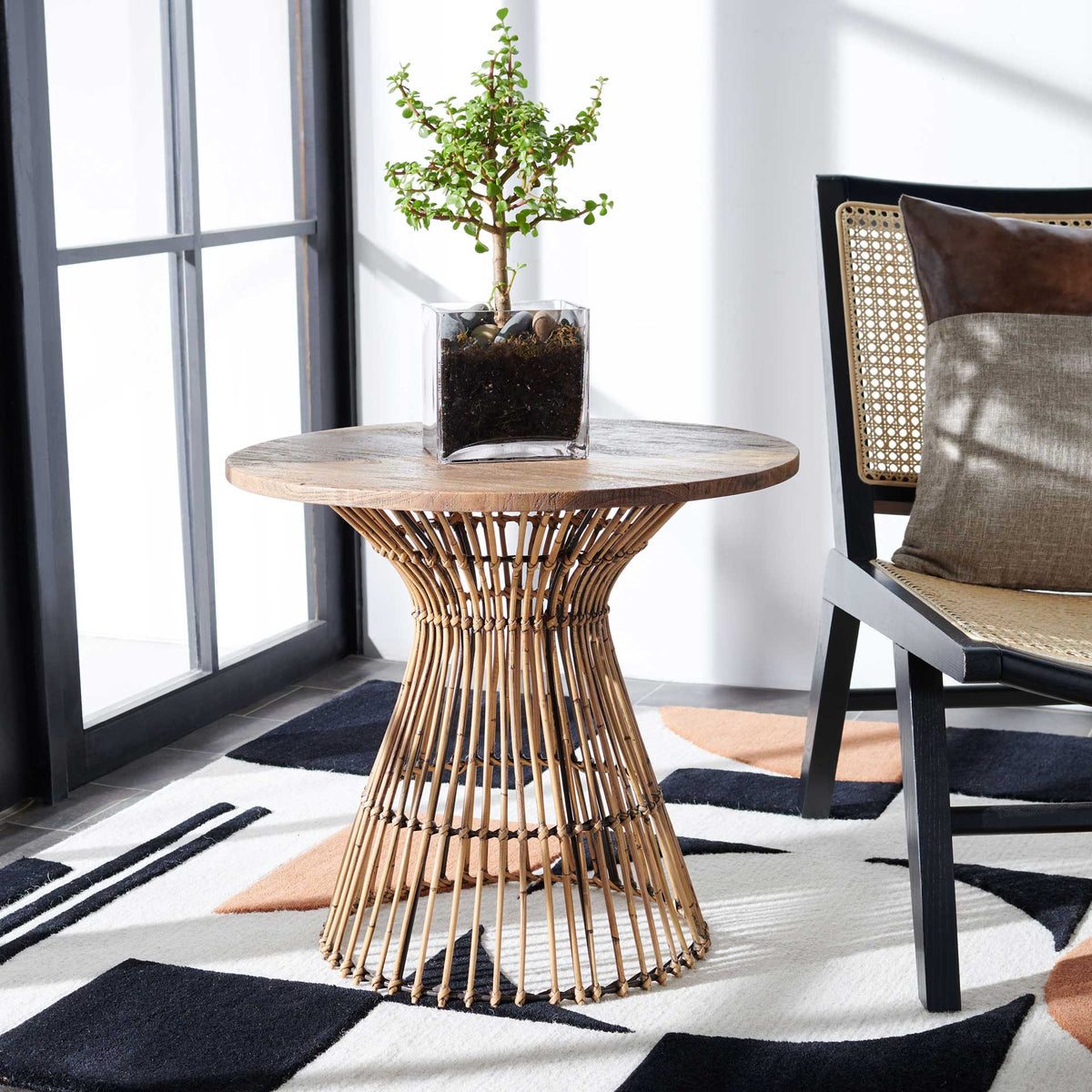 Warm honey brown wood and woven rattan bring a relaxed, natural accent beside a chair.