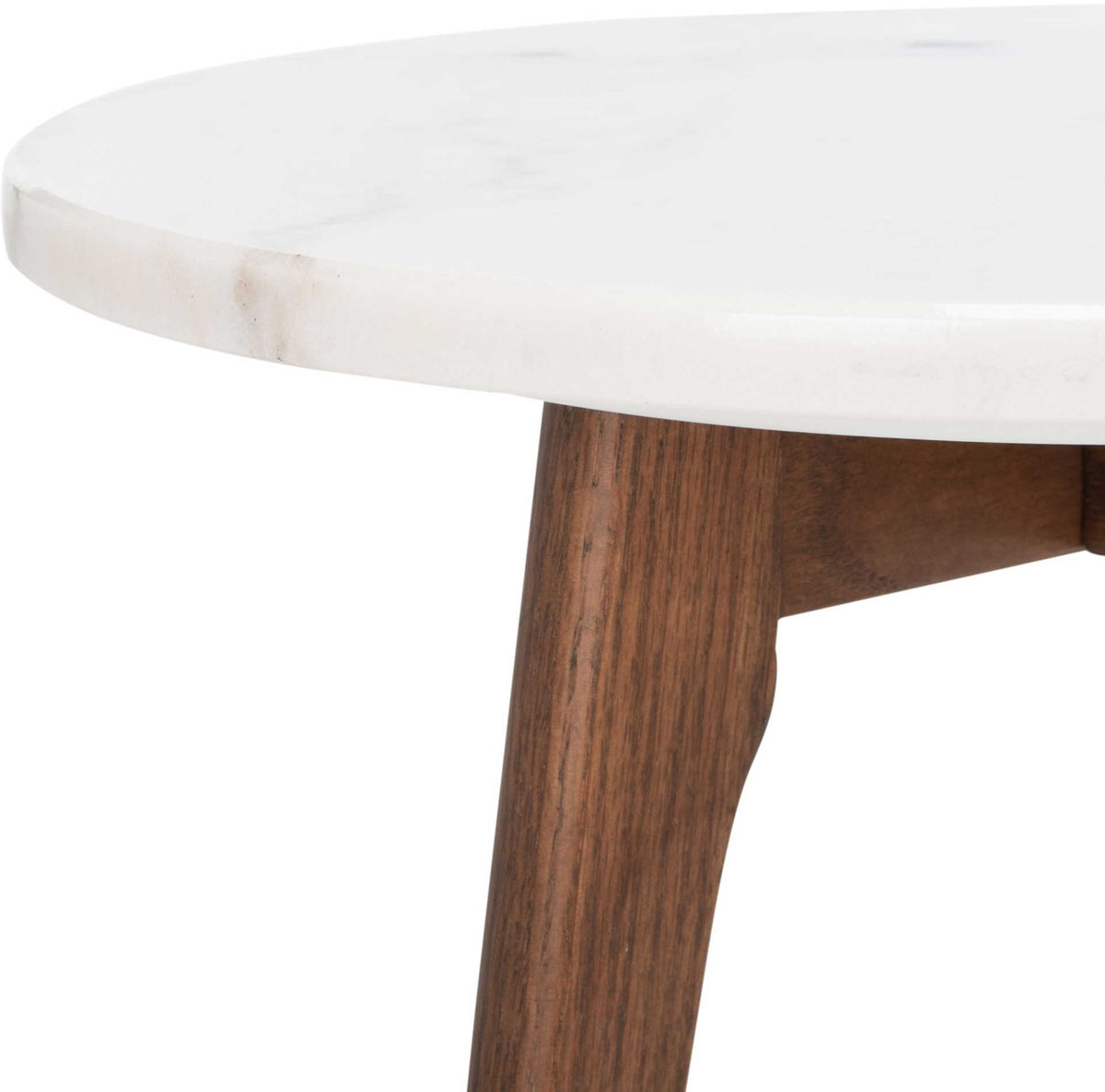 Subtle marble veining and rich wood grain bring texture to this mixed-material table.