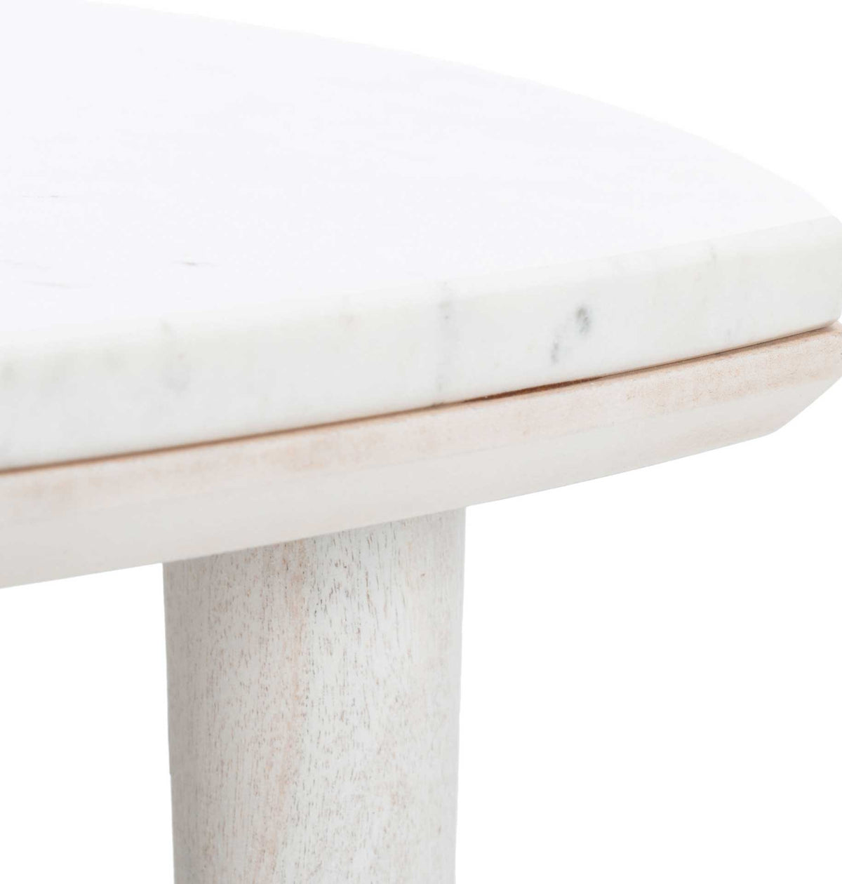 Subtle gray veining accents the thick white marble top above a whitewashed wood frame