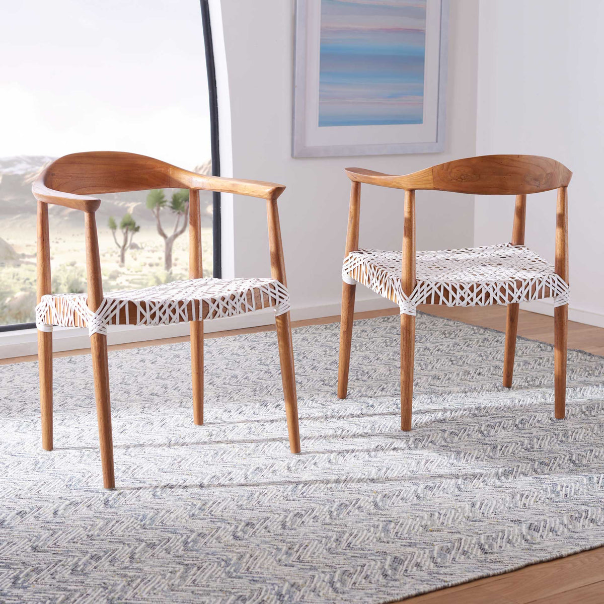 Curved wood backrests and white woven seats bring light, organic texture to a bright room.